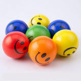 Groupe de 7 balles anti-stress Smiley colorées, chacune arborant un visage souriant.