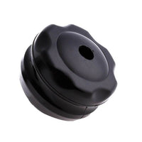 Base noire vide de la boule de massage, munie d’un orifice central permettant l’insertion du rouleau.