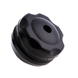 Base noire vide de la boule de massage, munie d’un orifice central permettant l’insertion du rouleau.