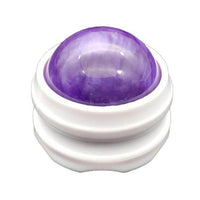 Boule de massage violette avec sa base blanche, idéale pour réduire les douleurs et favoriser la détente.
