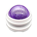 Boule de massage violette avec sa base blanche, idéale pour réduire les douleurs et favoriser la détente.