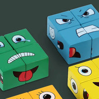 Cubes bleu et vert montrant des visages expressifs (colère, tristesse), parfaits pour découvrir et comprendre les émotions