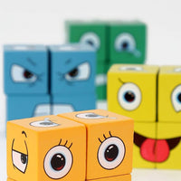 Gros plan sur deux cubes orange illustrant des yeux et des expressions, avec d’autres cubes colorés (bleu et vert) en arrière-plan