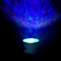 Ocean Wave - Projecteur de vagues diffusant un effet d’eau bleuté dans l’obscurité