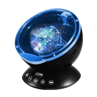 Ocean Wave - Projecteur de vagues noir avec dôme bleu, diffusant un effet océan lumineux