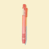 Stylo gomme rouge transparent vu de face
