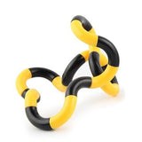  Tortillon de manipulation sensorielle, alternant segments jaunes et noirs, formant une boucle flexible